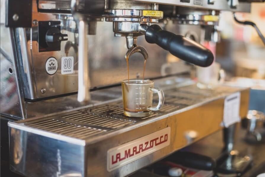 Espresso pouring from machine at The Hub in West Bend, Wisconsin.